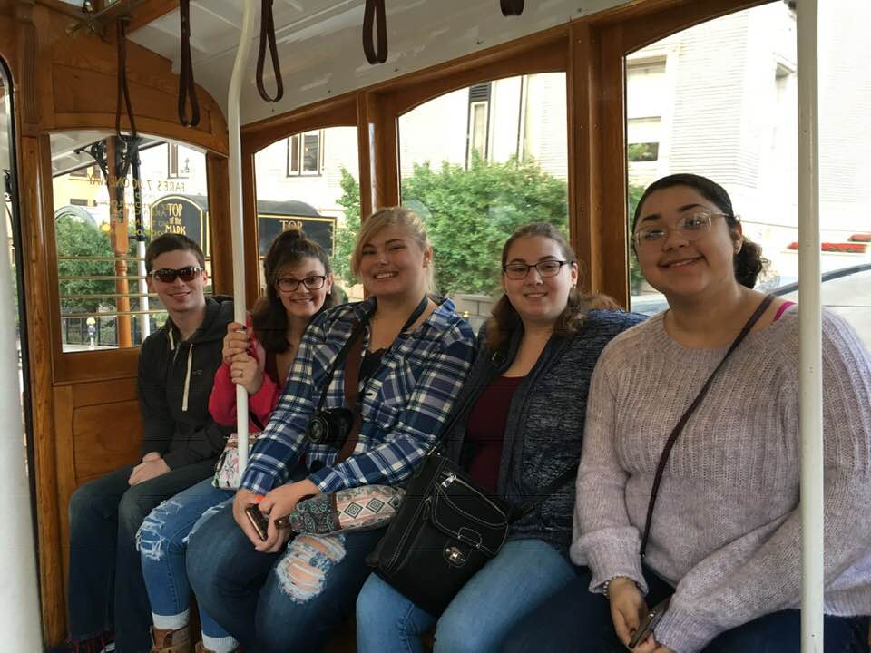 Hospitality students on a street car in San Francisco