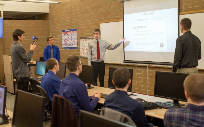 IT students presenting in front of a class