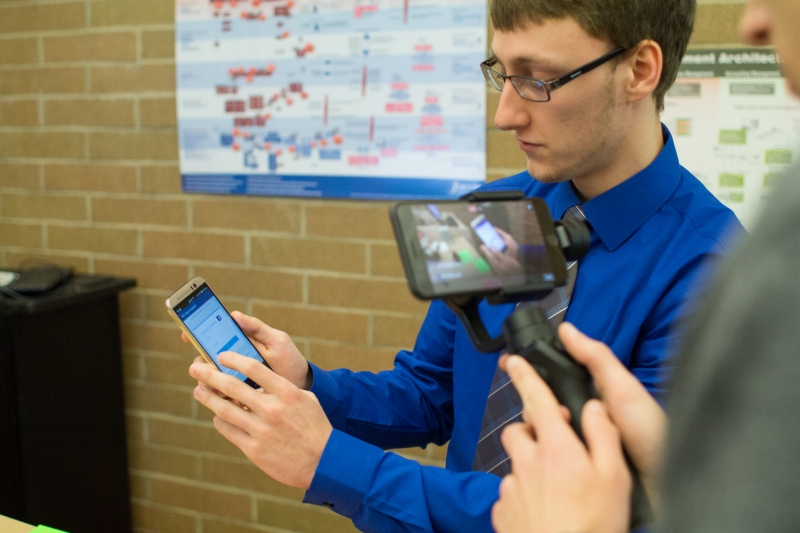 A student holding a mobile device