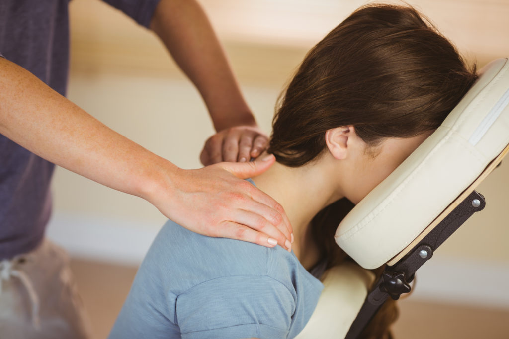 A photo of a woman receiving a massage.
