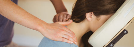 A photo of a woman receiving a massage.