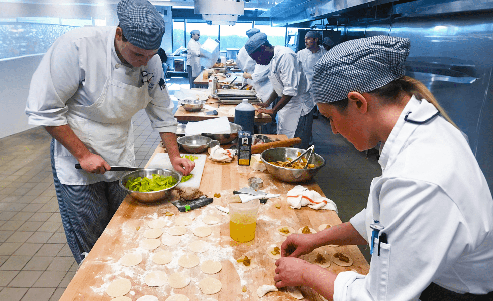 Culinary students working in the school kitchen.