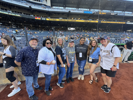 A photo of alumni with Dr. Harvey-Smith at PNC Park.