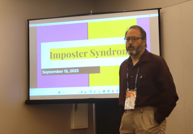 A photo of Mr. Cottrell speaking during the "Unmasking Success: Overcoming Imposter Syndrome" workshop.